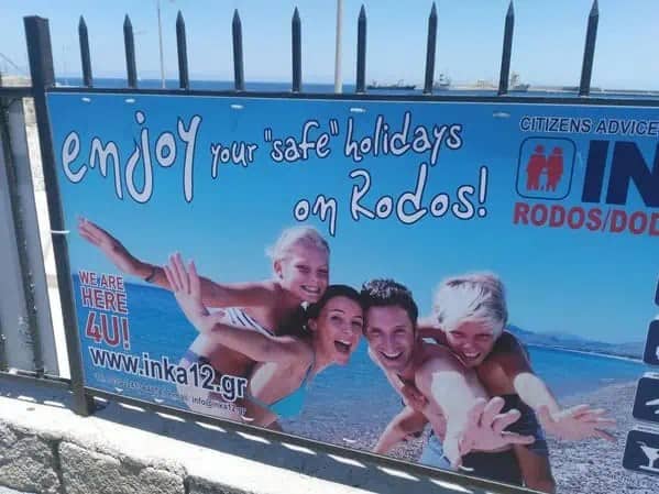 Billboard advertising a safe holiday on Rodos with quotes mistakenly placed around safe.