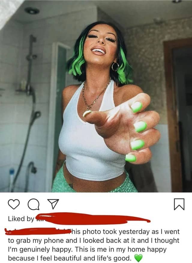 Woman holding out her hand to take a photo claiming it was completely accidental.
