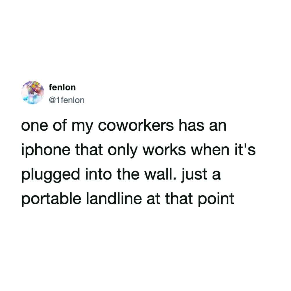 A hilarious tech struggle funny work tweet by @1fenlon describing a coworker's iPhone that only functions while plugged into a wall outlet like a modern landline.