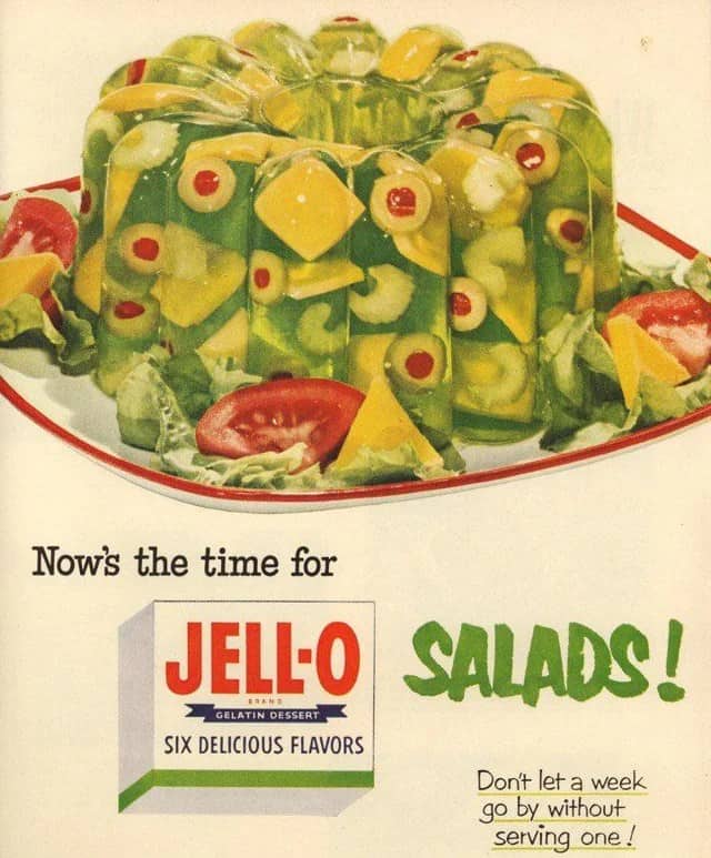 Vintage advertisement showing stuffed olives and vegetables suspended inside green Jell-O gelatin 50s memes
