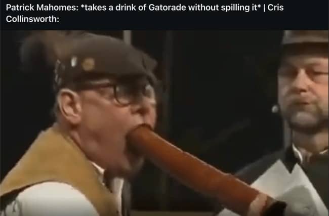 Man in a hat with a long wooden horn in his mouth, joking about Cris Collinsworth