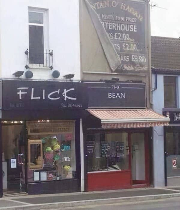 Two neighboring shopfronts named Flick and The Bean sit side by side on a street.