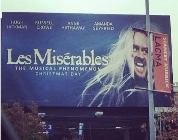A Stanley Kubrick banner aligns with a Les Miserables billboard so a manic face appears.