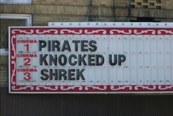Cinema marquee lists three film titles that read as one unfortunate sentence in sequence.