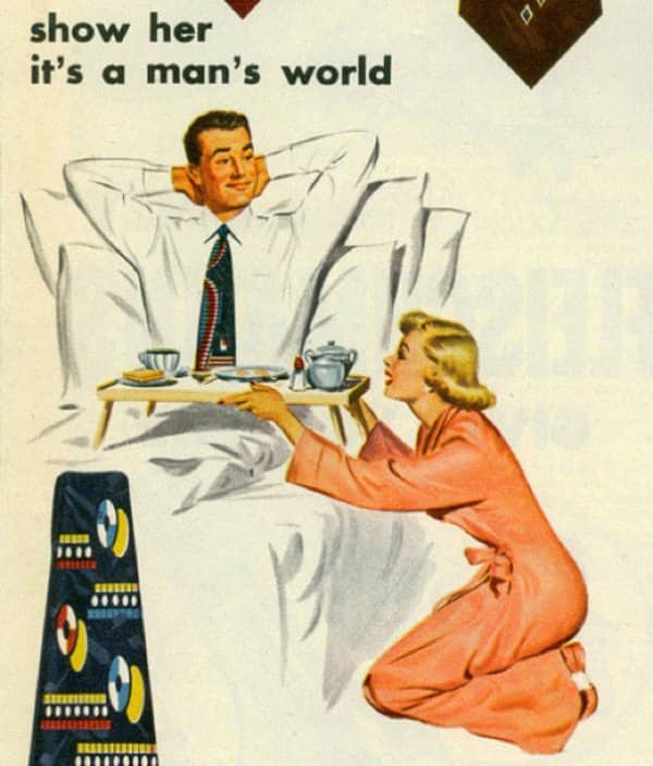 Necktie ad urging men to show her it's a man's world during breakfast in bed.