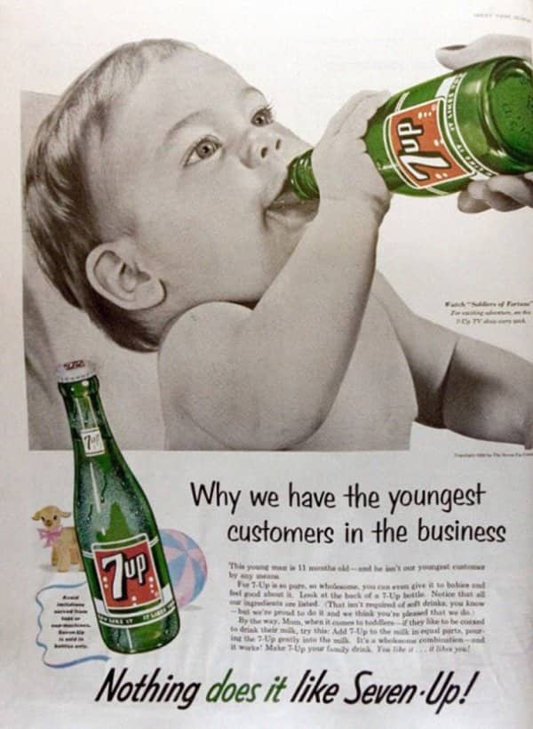Seven Up ad showing a baby drinking soda from a bottle, bragging about young customers.