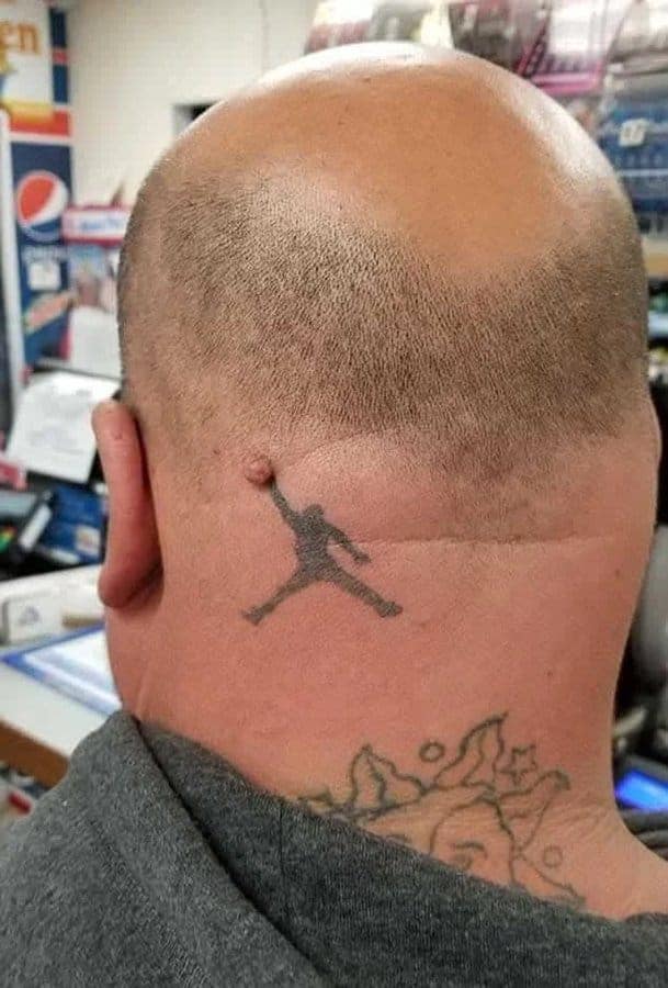 Bald man with a Jumpman logo tattoo on the back of his head.
