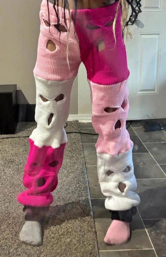 Pants stitched together from pink and white ski masks with the eye holes intact.