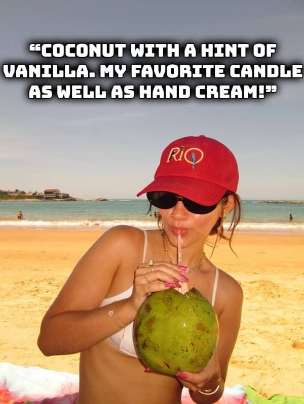 Woman drinking fresh coconut water on the beach representing tropical vacation scents and smells.