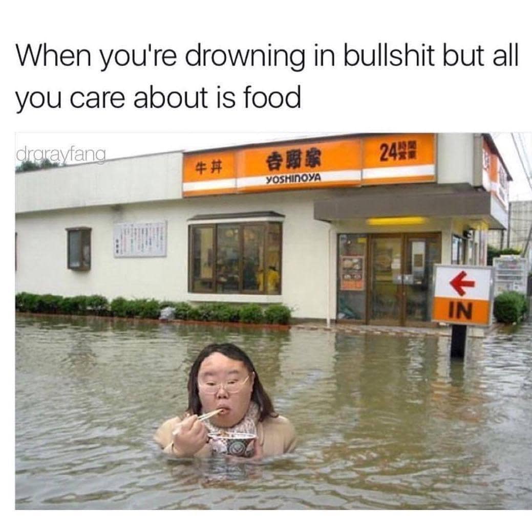 Flood survivor sitting waist-deep in murky floodwaters outside a restaurant calmly eating a bowl of food with chopsticks in a classic meme.