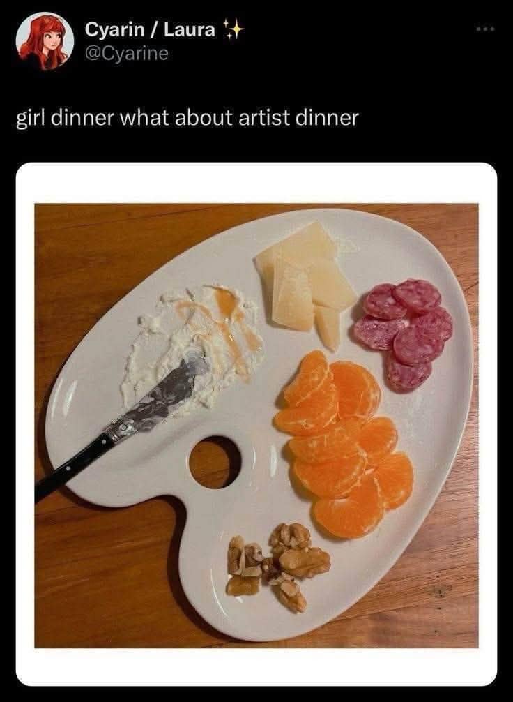 Painter's ceramic palette repurposed into a snack board with salami, cheese, and clementines for artist dinner in a classic meme.