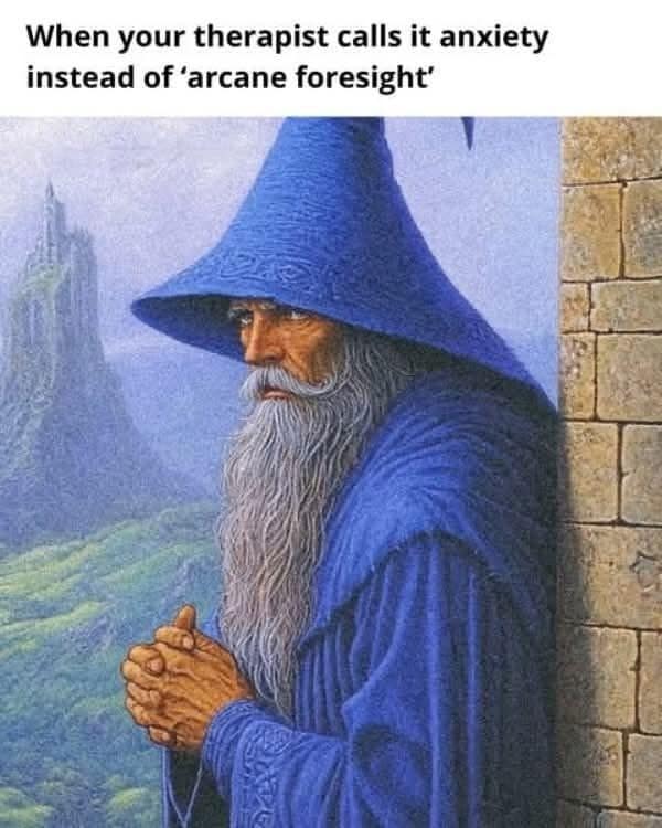 Classical fantasy illustration of a blue wizard pondering, captioned about therapy diagnosing anxiety over arcane foresight in a classic meme.