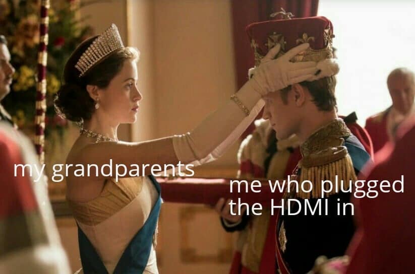TV screenshot from The Crown showing coronation labeled as grandparents honoring a grandkid for plugging in an HDMI cable in a classic meme.