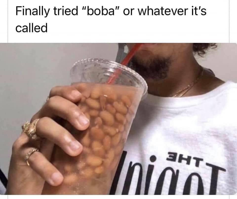 Person drinking a clear plastic cup of baked pinto beans through a straw after mistaking it for boba tea in a classic meme.