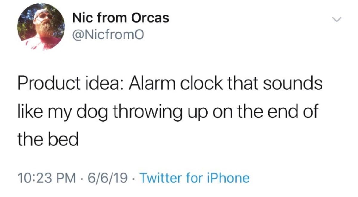 Tweet proposing an alarm clock sound effect that mimics a dog gagging on the bed to guarantee an instant wake-up call, captured as a classic meme.
