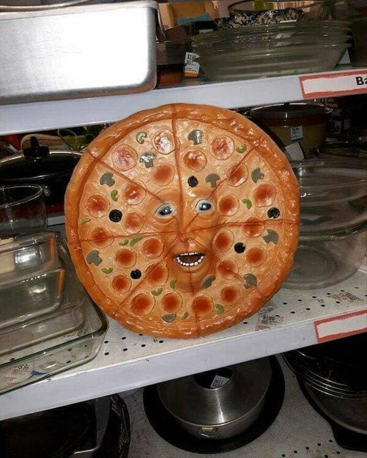 Thrift store ceramic pizza platter featuring an unsettlingly realistic human face sculpted into the center in a classic meme.