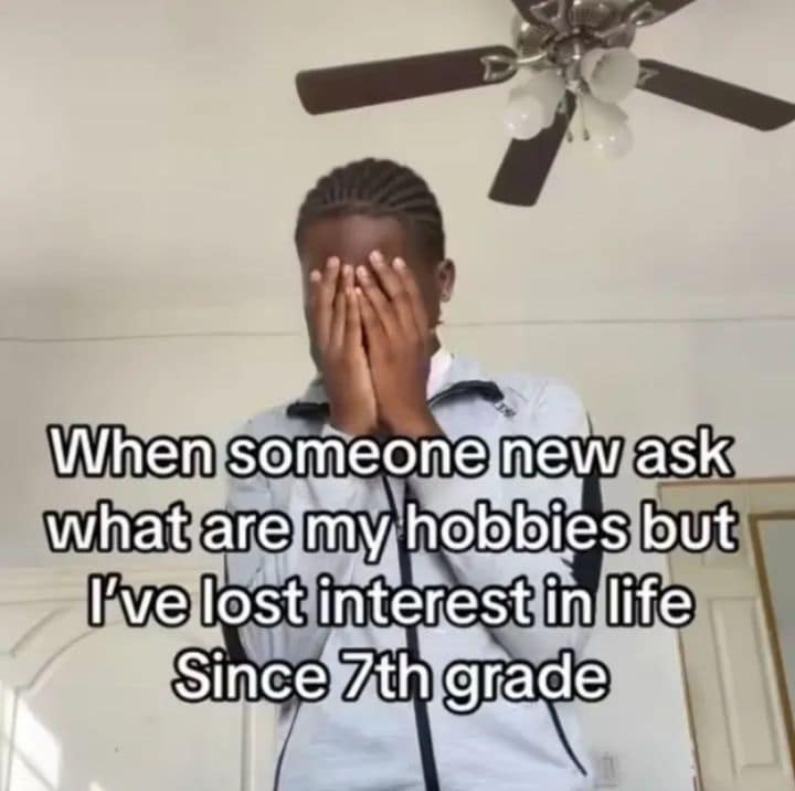 Man hiding his face under a ceiling fan with text about losing interest in hobbies since 7th grade in a classic meme.