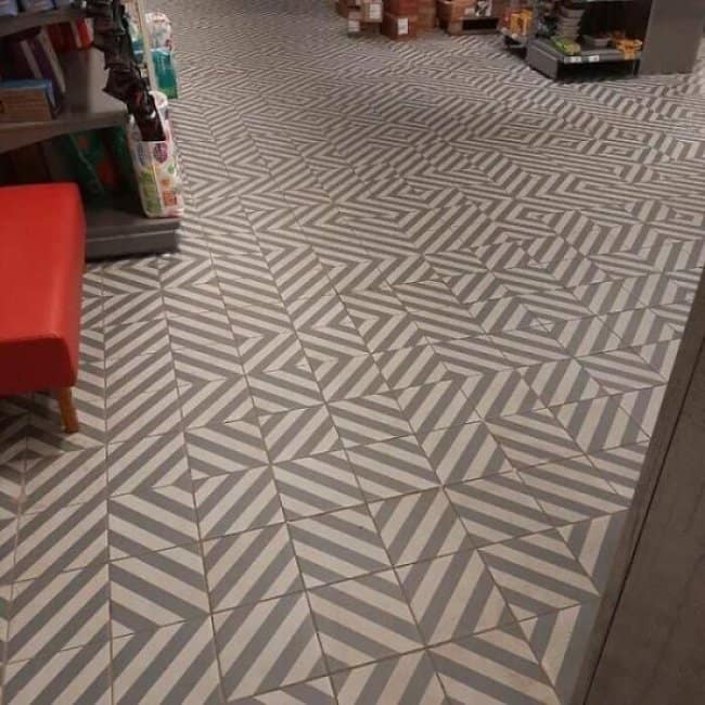 Construction fails on the floor: zigzag tiles laid so every pattern clashes.