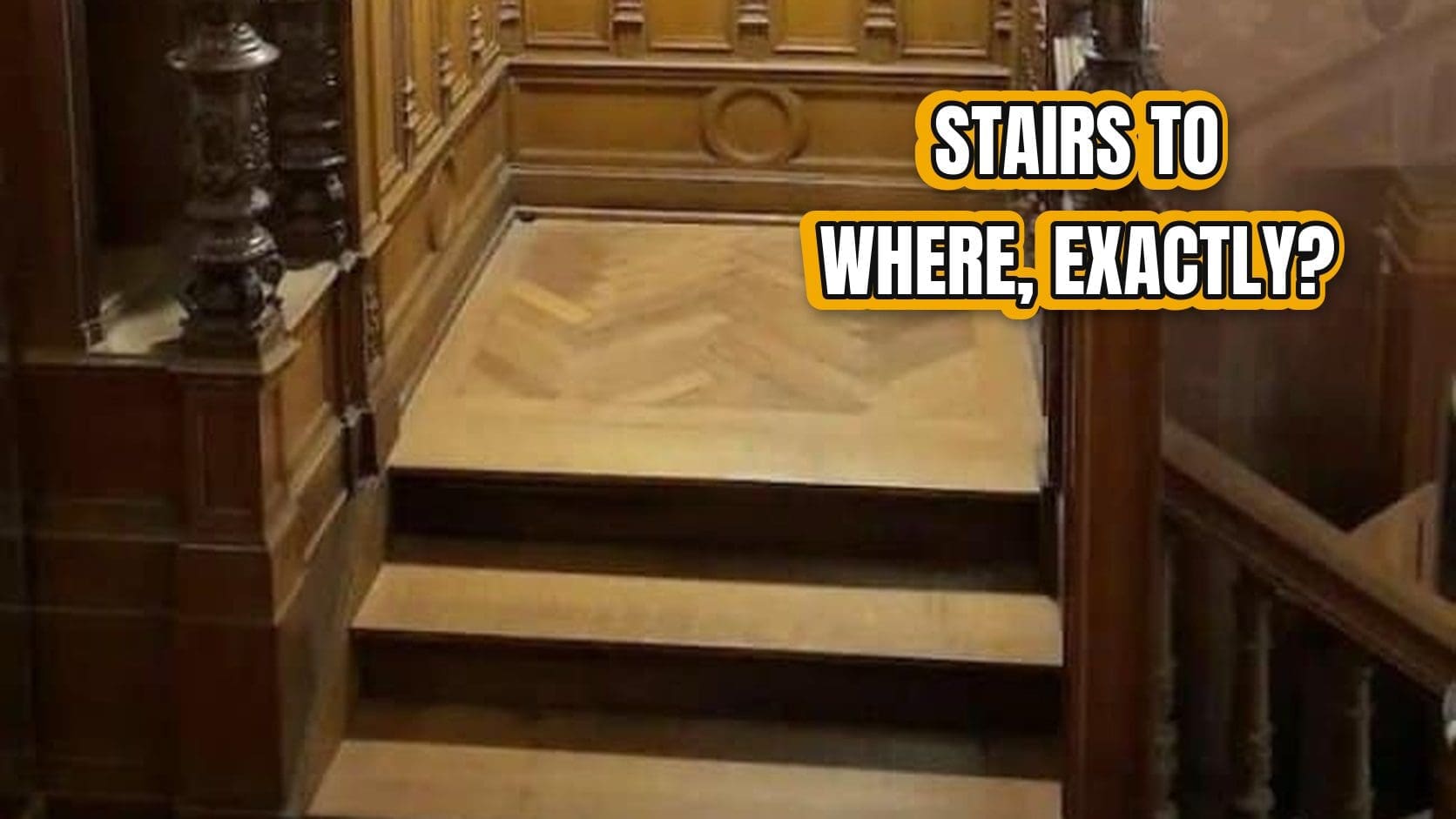 Ornate wooden staircase that climbs to a paneled wall, one of the grandest construction fails in this gallery.