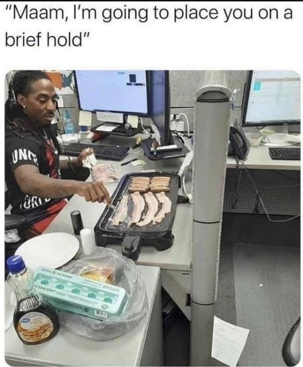Call center employee frying bacon and eggs at his cubicle while putting a caller on hold in a customer service meme.