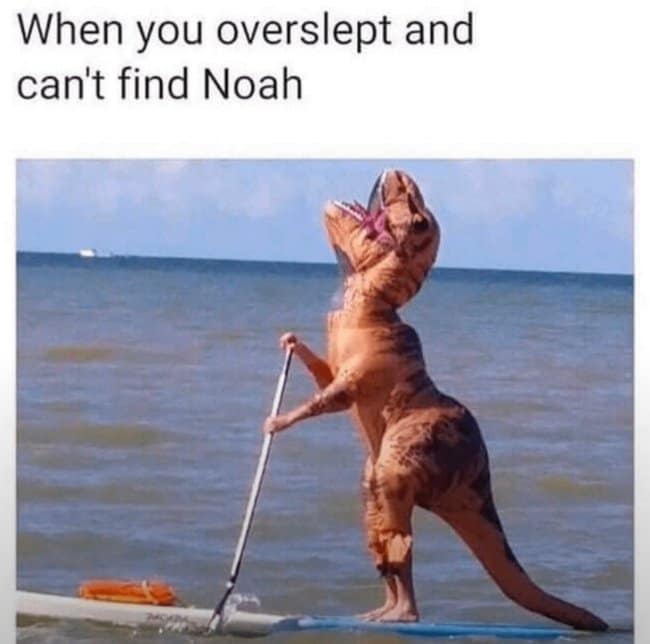 Person in an inflatable T-Rex costume standing on a paddleboard in the ocean, captioned about missing Noah's Ark in a dinosaur meme.