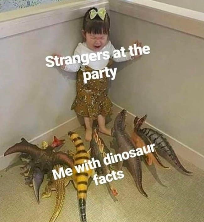 Crying toddler cornered by a ring of plastic toy dinosaurs, labeled as cornering party guests with unprompted paleontology facts in a dinosaur meme.