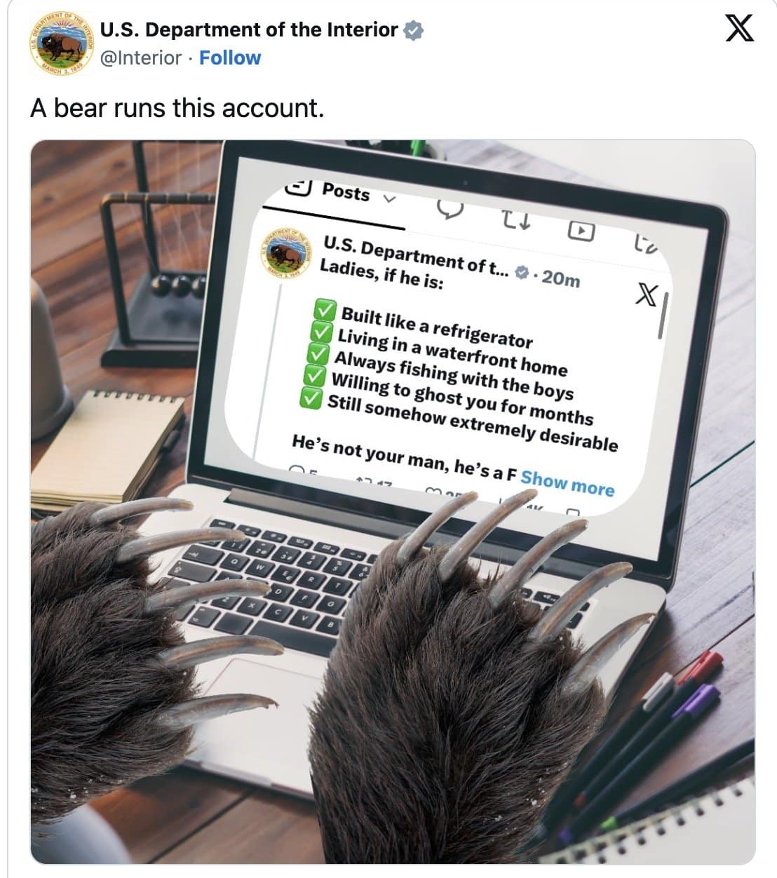 Bear paws typing on a laptop in an Interior Department fat bear joke