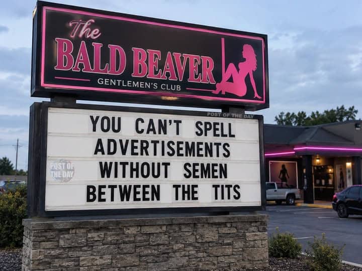 Funny billboard sign outside a gentleman's club with humorous text play on words.