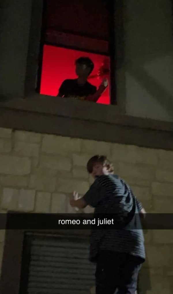 Funny Snapchat meme parodying Romeo and Juliet with two guys outside a red window.