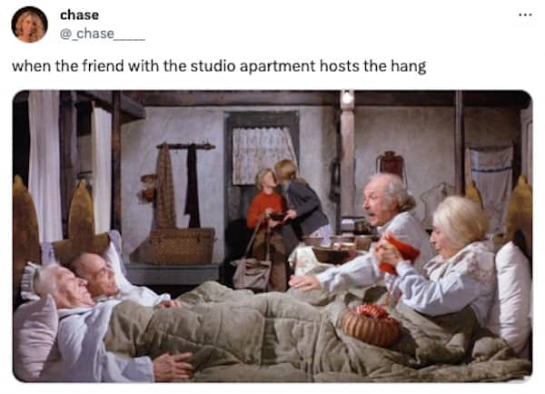 Willy Wonka movie scene with four grandparents in bed hosting a studio apartment hang.