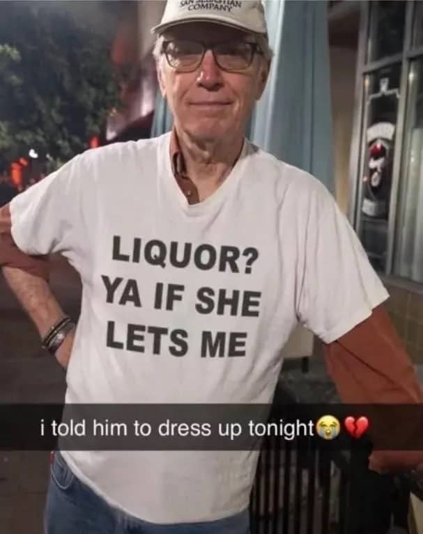 Older man wearing a funny white graphic t shirt with humorous double entendre text.