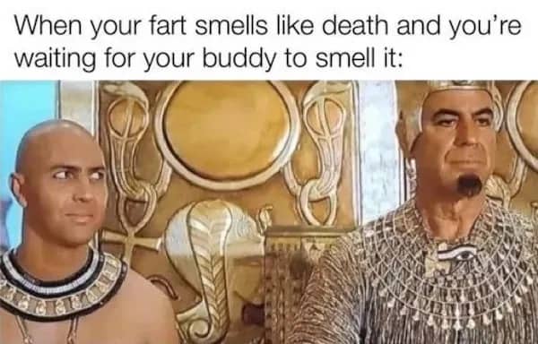 Ancient Egyptian scene from movie with two men glancing nervously under funny memes caption.