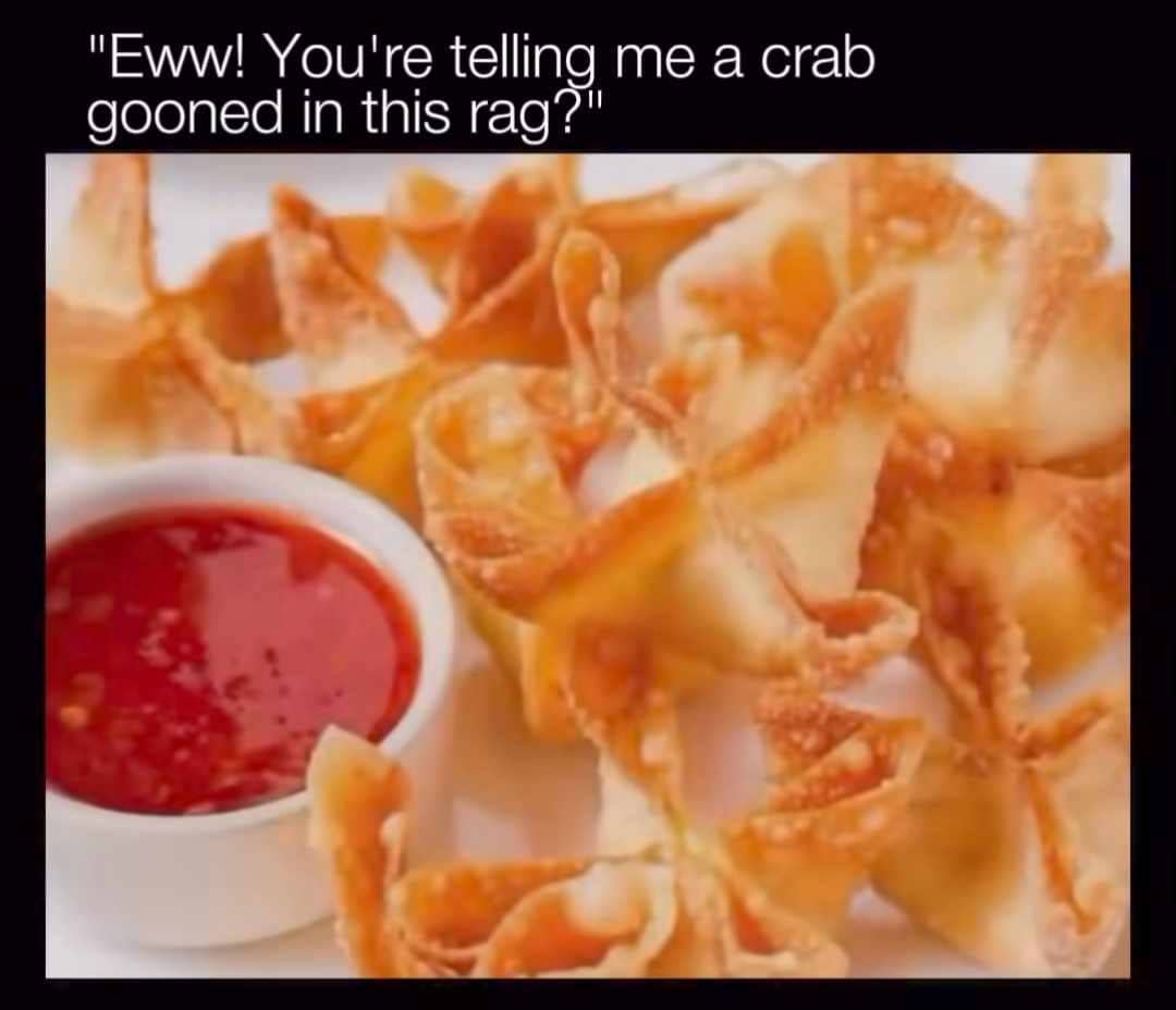 Plate of crispy fried crab rangoon appetizers served with sweet chili dipping sauce.