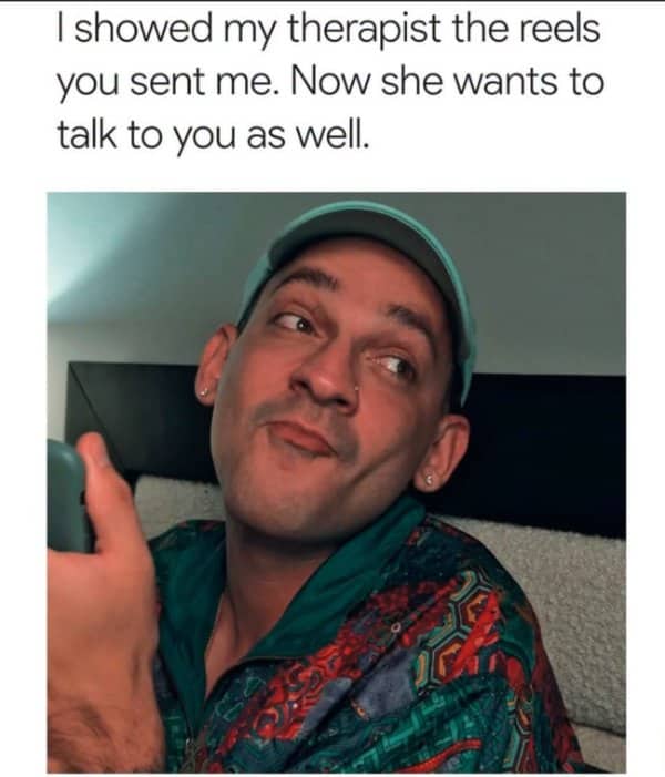 Man in a colorful shirt smirks at his phone while relaying what his therapist said.