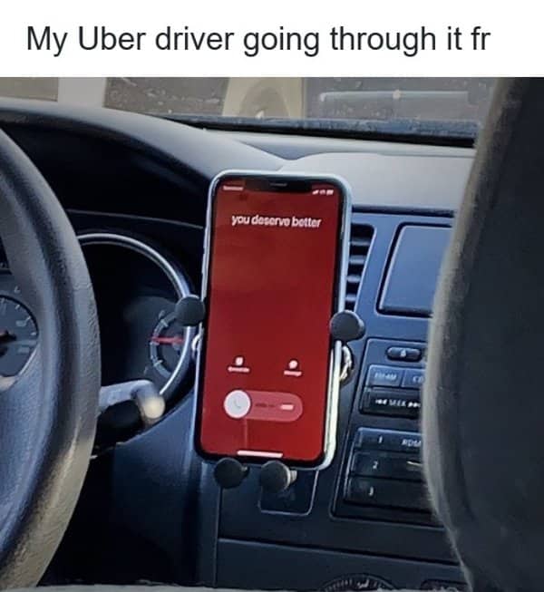 Phone mounted on a car dashboard shows an incoming call saved as you deserve better.