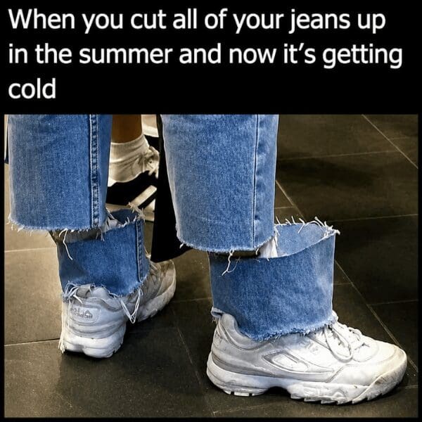 Person wearing cutoff denim shorts over detached jeans cuffs around white sneakers, captioned about seasonal wardrobe regret in a meme dump.