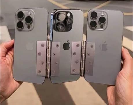 DIY triple-screen phone contraption made by screwing metal door hinges directly into three gray iPhones in a meme dump.