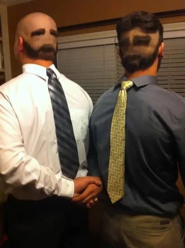 Two men with haircut designs shaved into the back of their heads to resemble faces wearing ties backward in a meme dump.