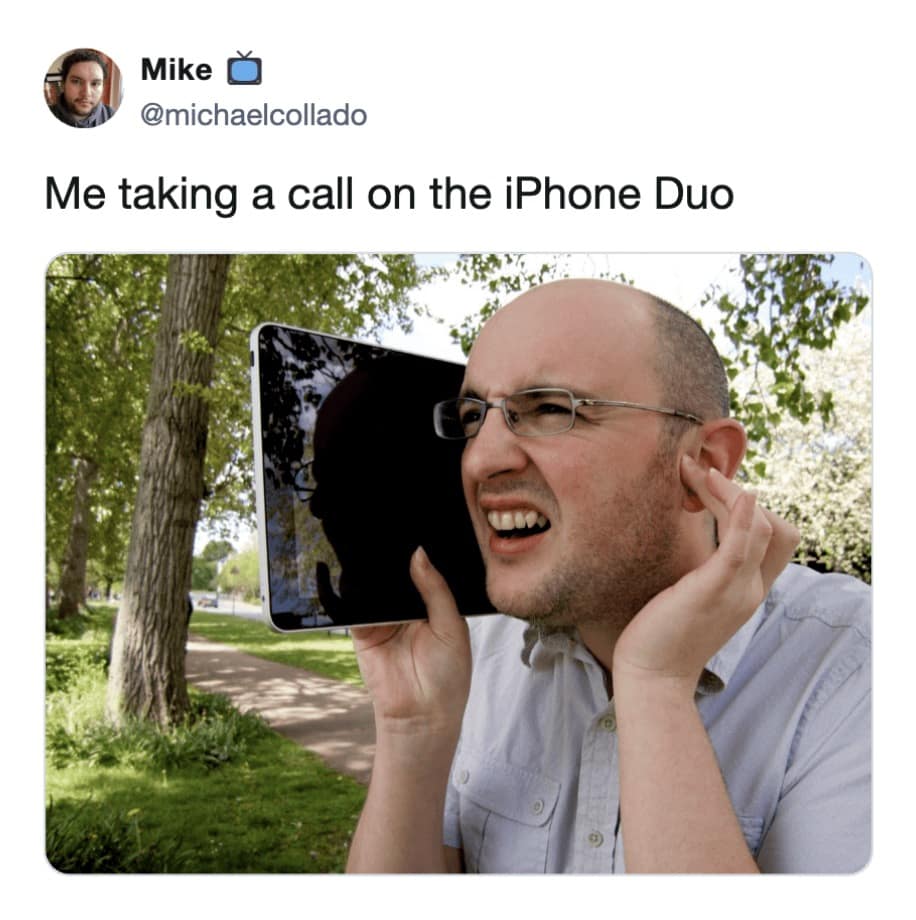 Man holding a giant tablet screen up to his face like a massive mobile phone in a hilarious meme about taking calls on the iPhone Duo.