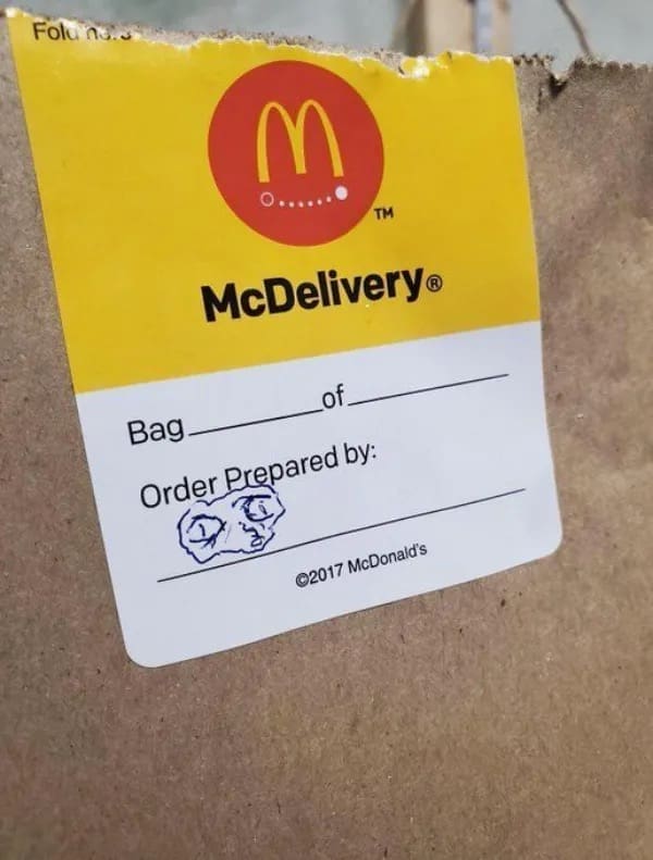 McDonald's takeout delivery bag featuring a panicked scribble face drawn under 'Order Prepared by' in a meme dump.