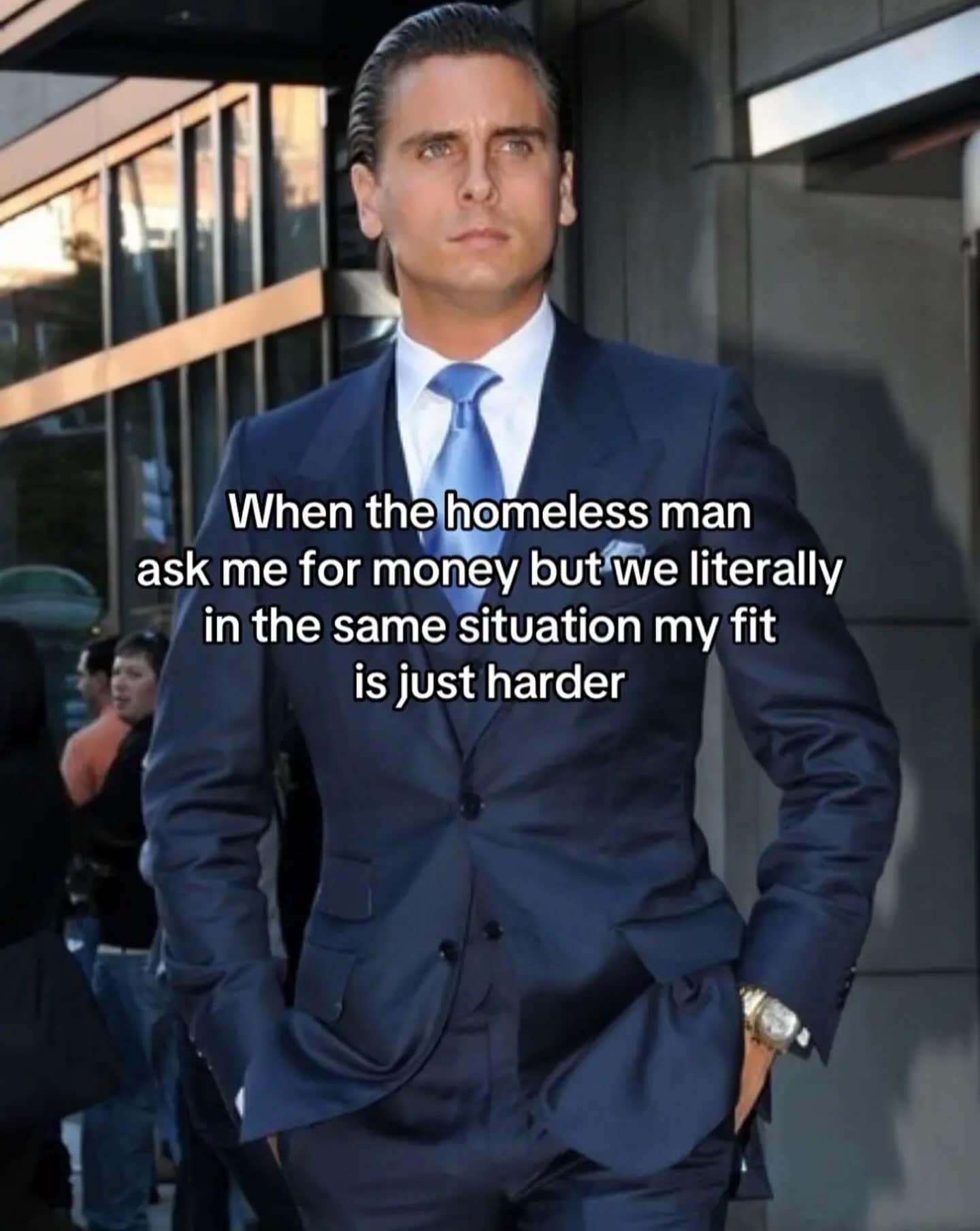 Scott Disick in a sleek suit captioned as being broke but having a better outfit than a street beggar in a meme dump.