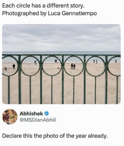 Perfectly framed beach photography shot through circular metal fence posts isolating individual people, featured in a funny memes post.