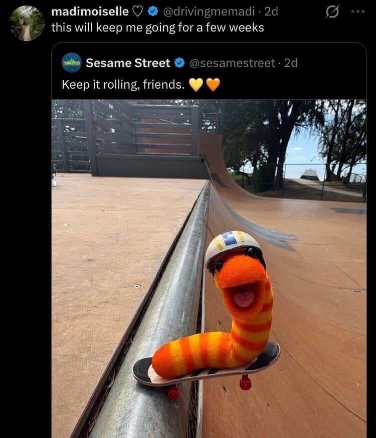 Sesame Street tweet showing a fuzzy orange worm in a helmet riding a skateboard ramp.