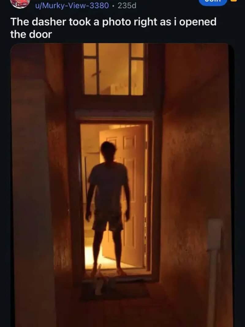 Creepy backlit doorway photo taken by a DoorDash driver capturing a shadowy silhouette waiting for food in a meme dump.