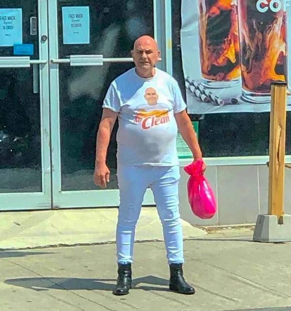A bald man dressed head-to-toe in white shirt and pants posing next to Mr. Clean branding in a meme dump.