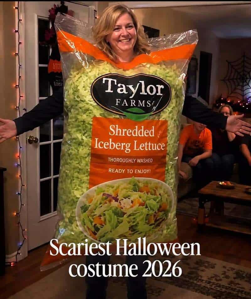 Woman wearing a giant costume styled as a bag of Taylor Farms Shredded Iceberg Lettuce labeled as a scary costume in a meme dump.