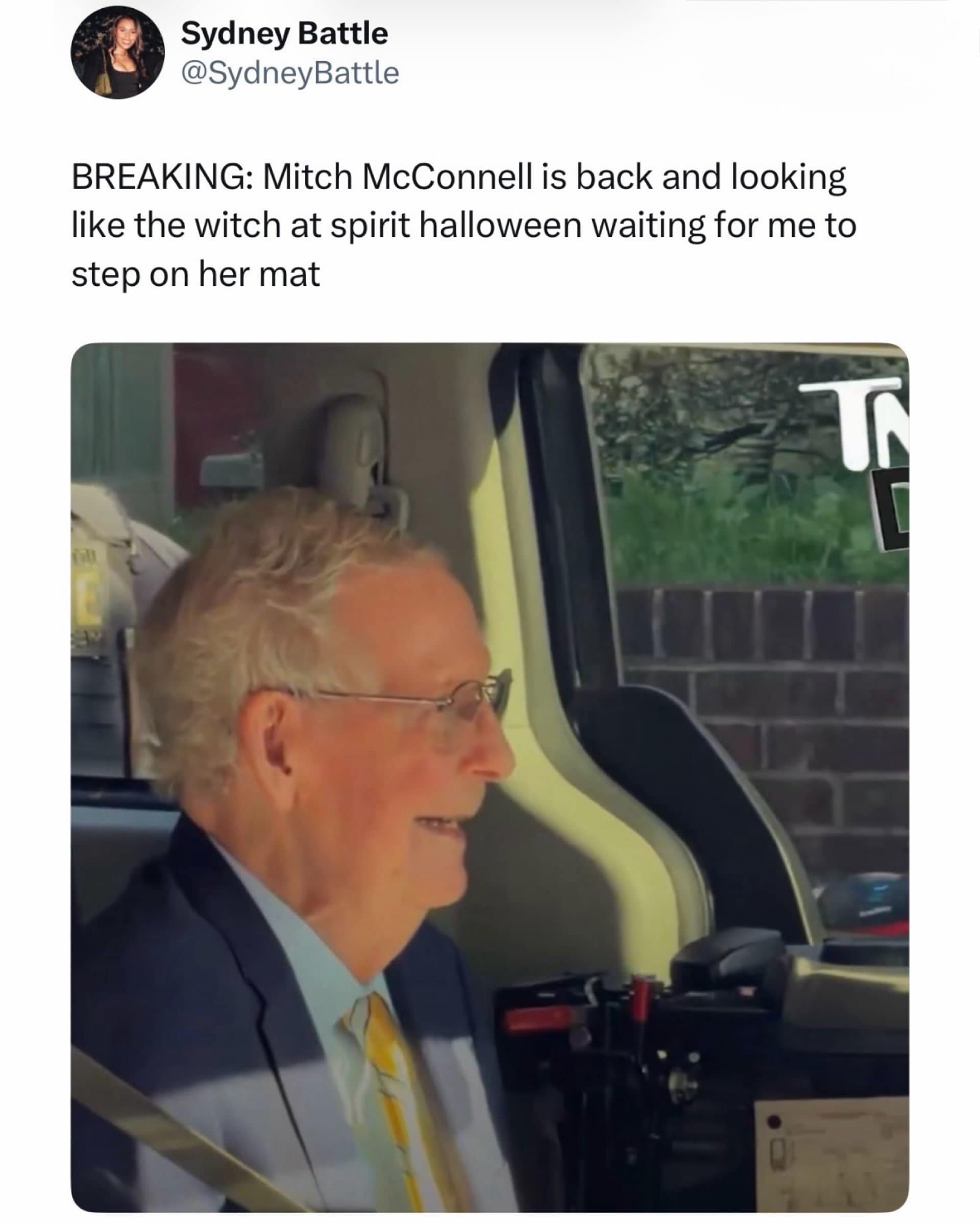 Tweet comparing a blankly smiling Mitch McConnell in a transport van to an animatronic Spirit Halloween prop in a meme dump.