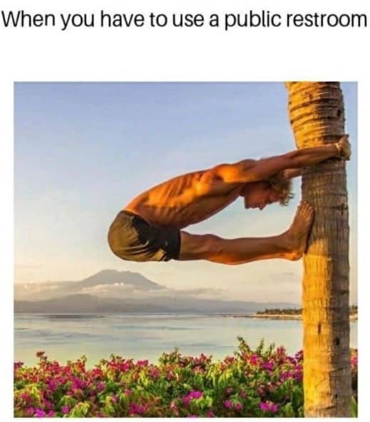 Shirtless man doing extreme flexibility stretch against palm tree under public restroom meme text.