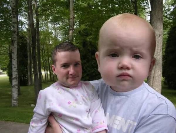 Hilarious faceswap photo of an adult man and a baby sitting outside together.