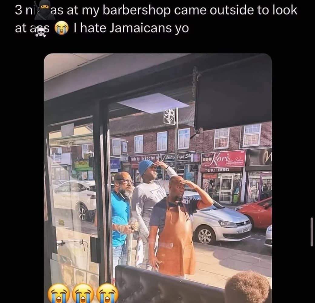 Barbers looking out window together at street walkway featured in funny internet meme.